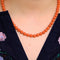 Collier Collier boules de corail rouge en or jaune 750 58 Facettes
