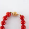 Collier Collier boules de corail rouge en or jaune 750 58 Facettes