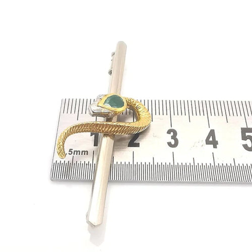 Broche Broche serpent en or jaune et blanc 18 carats émeraude et diamants 58 Facettes