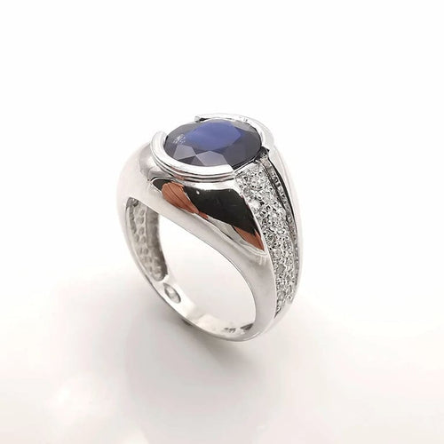 Bague 53 Bague en or blanc 18 carats, saphir ovale et diamants 58 Facettes