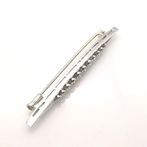 Broche Broche ancienne en or blanc 18 carats et diamants 58 Facettes