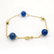 Bracelet Bracelet en or jaune 18 carats avec perles bleues 58 Facettes