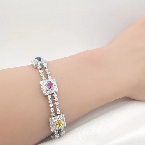 Bracelet Bracelet en or blanc 18 carats saphirs multicolores et diamants 58 Facettes Bracelet or blanc saphirs diamants certifié HRD Anvers