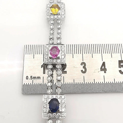 Bracelet Bracelet en or blanc 18 carats saphirs multicolores et diamants 58 Facettes Bracelet or blanc saphirs diamants certifié HRD Anvers