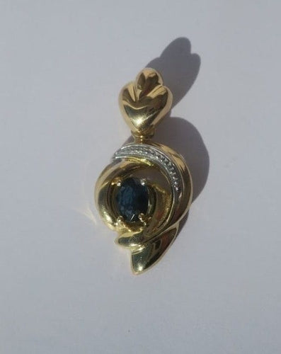Pendentif Pendentif cœur bicolore en or 18 carats et saphir 58 Facettes