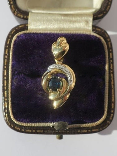Pendentif Pendentif cœur bicolore en or 18 carats et saphir 58 Facettes