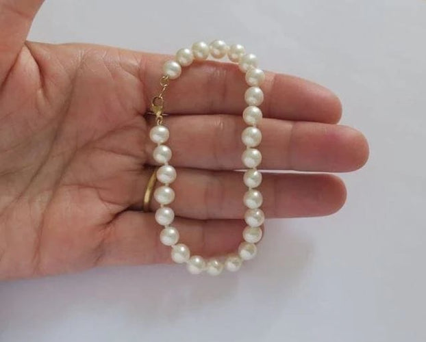 Bracelet Bracelet en or jaune et perles de culture 58 Facettes