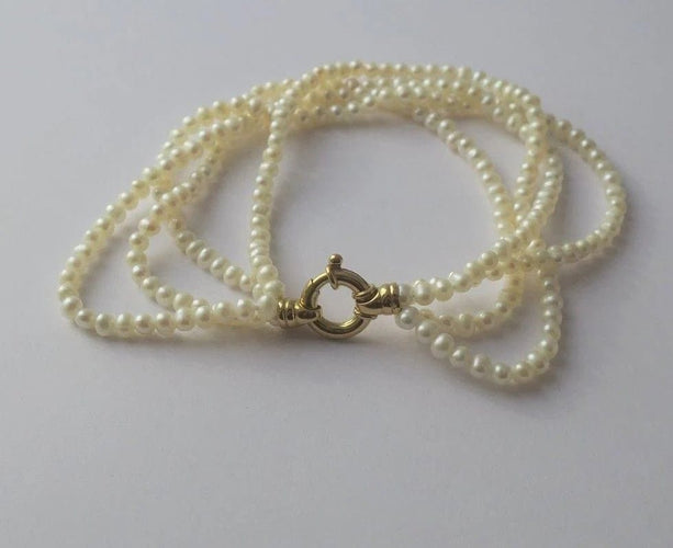Bracelet Bracelet quatre rangs en or jaune et perles de culture 58 Facettes