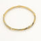 Bracelet Bracelet jonc torsadé en or jaune et or blanc 18K 58 Facettes