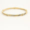 Bracelet Bracelet jonc torsadé en or jaune et or blanc 18K 58 Facettes