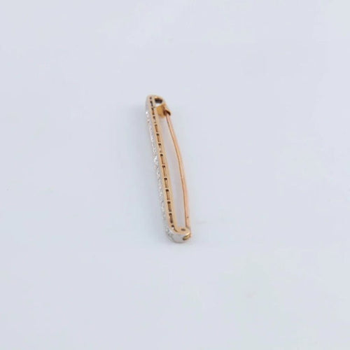 Broche Broche linéaire en or jaune 18K et platine sertie de diamants 58 Facettes