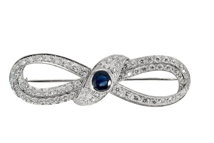 Broche Broche motif infini en platine 950, diamants et saphir 58 Facettes
