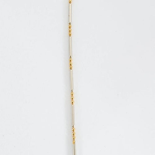 Collier Chaîne motif boules et barrettes en or jaune et or blanc 14K 58 Facettes