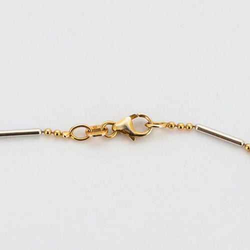 Collier Chaîne motif boules et barrettes en or jaune et or blanc 14K 58 Facettes