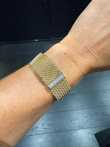 Montre Montre bracelet ruban tressé en or jaune 18 carats et diamants 58 Facettes 1.0000912/1