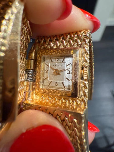 Montre Montre bracelet ruban tressé en or jaune 18 carats et diamants 58 Facettes 1.0000912/1