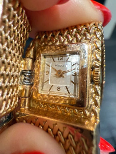 Montre Montre bracelet ruban tressé en or jaune 18 carats et diamants 58 Facettes 1.0000912/1