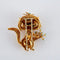 Broche Broche chat en or jaune 18k, turquoises, émeraudes et saphir 58 Facettes 2.173