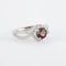 Bague 52 Tentation - Bague en or gris 18K avec saphir rose et diamants 58 Facettes 2.1122