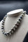 Collier Collier en perles de Tahiti avec fermoir en or blanc 18 carats 58 Facettes 355102