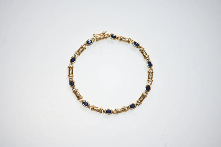 Bracelet Bracelet en or 18 carats avec diamants et saphirs 58 Facettes