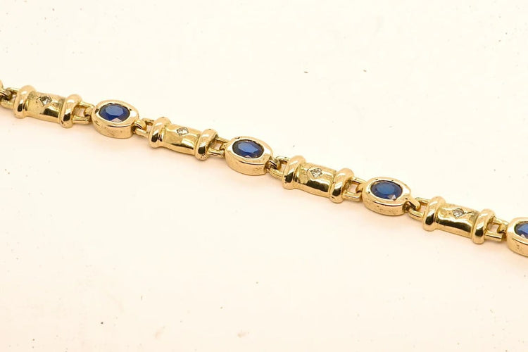 Bracelet Bracelet en or 18 carats avec diamants et saphirs 58 Facettes