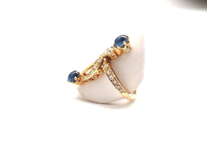 Bague 56.5 Bague en or jaune 750 avec diamants et saphirs cabochons 58 Facettes