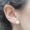Boucles d'oreilles Boucles d'oreilles en perles avec étoile en diamants en or blanc et jaune 18 carats 58 Facettes PE238TA159