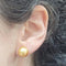 Boucles d'oreilles Boucles d’oreilles en or avec perles australiennes dorées 10,5–11 mm 58 Facettes TA50