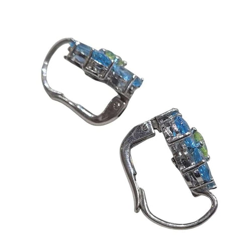 Boucles d'oreilles Boucles d'oreilles en or blanc 18 carats avec topaze bleue et péridot 58 Facettes PE802