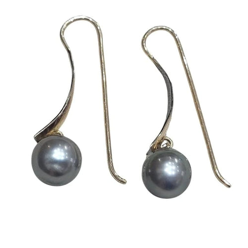 Boucles d'oreilles Boucles d’oreilles en perles de Tahiti en or jaune 18 carats 58 Facettes T135