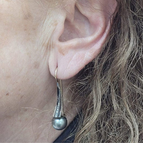 Boucles d'oreilles Boucles d’oreilles en perles de Tahiti en or jaune 18 carats 58 Facettes T135