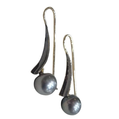 Boucles d'oreilles Boucles d’oreilles en perles de Tahiti en or jaune 18 carats 58 Facettes T135
