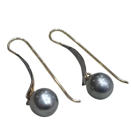 Boucles d'oreilles Boucles d’oreilles en perles de Tahiti en or jaune 18 carats 58 Facettes T135