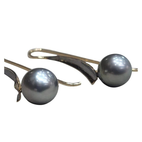 Boucles d'oreilles Boucles d’oreilles en perles de Tahiti en or jaune 18 carats 58 Facettes T135