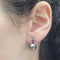 Boucles d'oreilles Boucles d'oreilles en or blanc 18 carats avec perles de Tahiti, rubellites et diamants 58 Facettes TA202