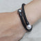 Bracelet Bracelet croix en acier noir avec perles de Tahiti et australienne 58 Facettes PUV221