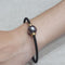 Bracelet Bracelet en perle de Tahiti en acier noir et or jaune 18 carats 58 Facettes PUV210