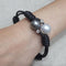 Bracelet Bracelet ajustable en cuir noir avec perles et diamants 58 Facettes P113