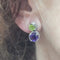 Boucles d'oreilles Boucles d'oreilles en or blanc 18 carats avec améthystes et péridots 58 Facettes PE836