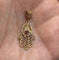 Pendentif Pendentif main de Fatima en filigrane en or jaune 18 carats 58 Facettes