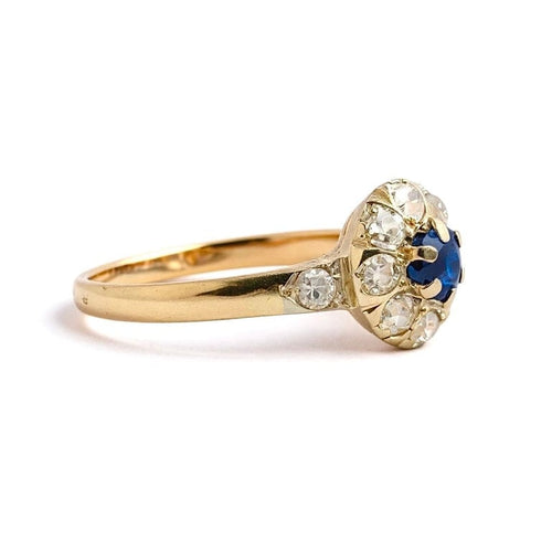 Bague 57 Bague marguerite ancienne en or jaune 18 carats, diamants et saphir 58 Facettes