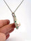 Collier Collier pendentif en or blanc 18 carats, mabé de Tahiti, émeraudes et diamants 58 Facettes