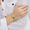 Bracelet Poiray - Bracelet jonc en or jaune 18 carats, diamants, saphir et émeraude 58 Facettes
