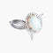 Broche Broche fleur en or gris 750 sertie d’une opale blanche 58 Facettes 444