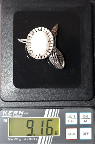 Broche Broche fleur en or gris 750 sertie d’une opale blanche 58 Facettes 444