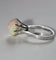 Bague 51 Bague en or blanc 18 carats avec opale et diamants 58 Facettes 585