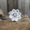Bague 52 Bague rosette en or blanc 18 carats avec diamants 58 Facettes 136043
