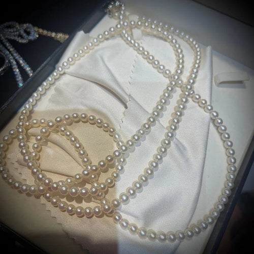 Collier Tasaki - Sautoir en perles de culture Akoya 120 cm avec certificat 58 Facettes 8059A