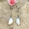 Boucles d'oreilles Poema - Pendants d’oreilles en or blanc 18k, argent, perles fines et diamants 58 Facettes 70